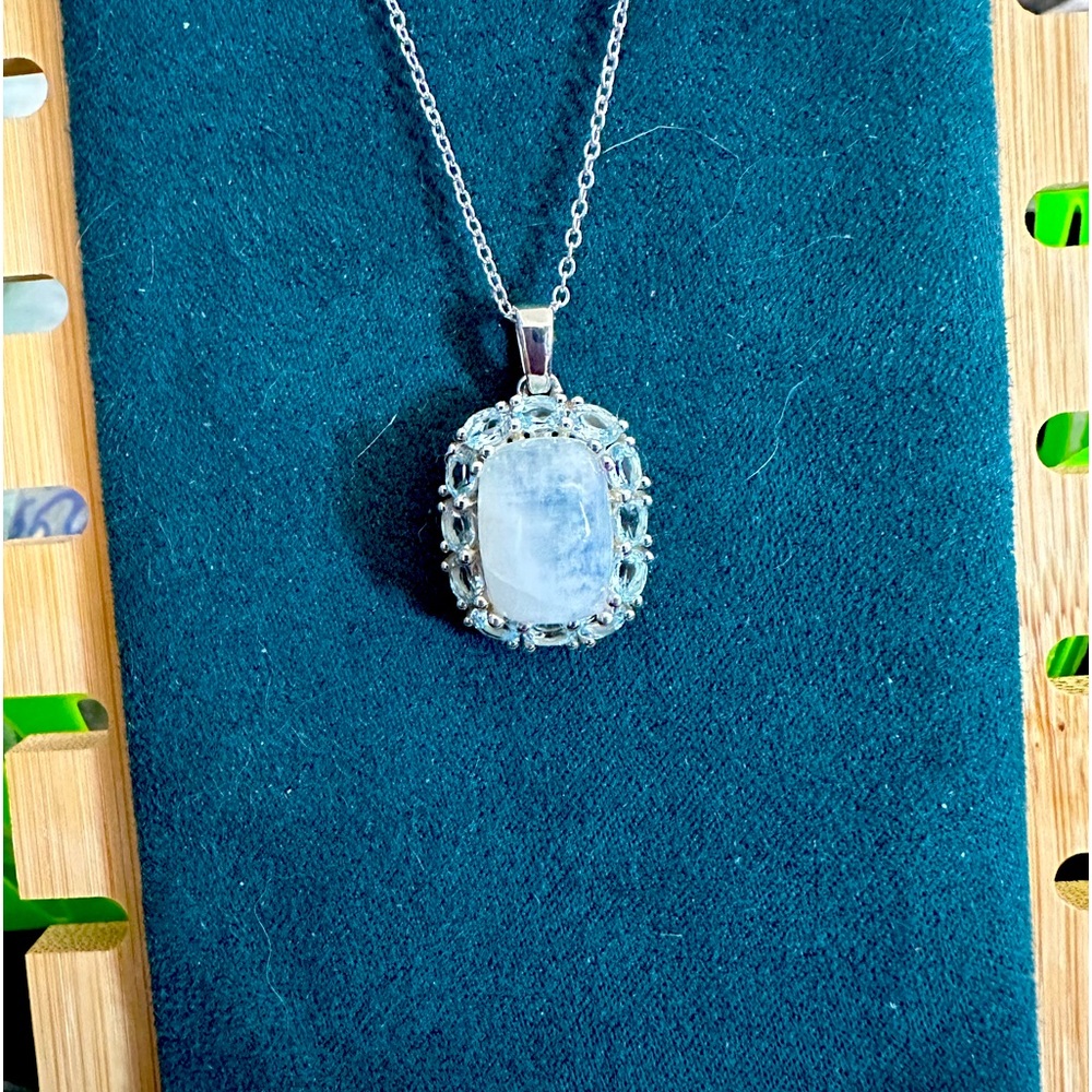 Sterling Silver Moonstone surrounded by Sky Blue Topaz Sterling Silver 18” Chain